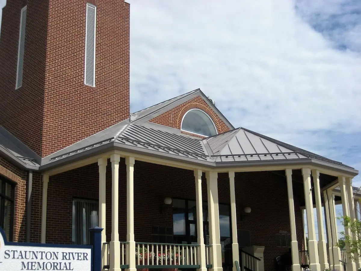 Skilled roofing craftsmen working on a residential roof in Gainesville